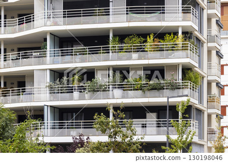 Modern apartment building with balconies and plants in Montpellier, France 130198046