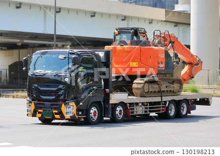 Truck transporting heavy machinery Truck transporting heavy machinery 130198213