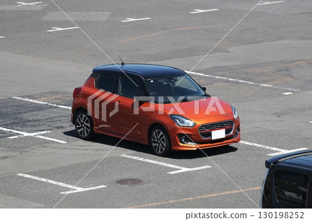 Red compact car 130198252