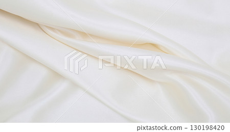 Smooth elegant white silk or satin luxury cloth texture as wedding background. Luxurious background design 130198420