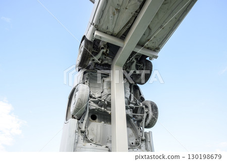 Homemade sculpture of three cars. Monument to the cyrillic lette 130198679