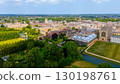 Cambridge University buildings and parks embracing River Cam on a sunny summer day 130198761