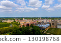 Aerial view of Cambridge University colleges, river Cam and green areas under cloudy sky 130198768