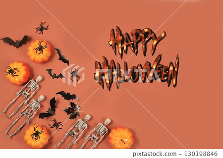 Happy halloween concept, background with congratulations, pumpkins, spiders and bats top view, greeting card or banner, template for design, selective focus 130198846