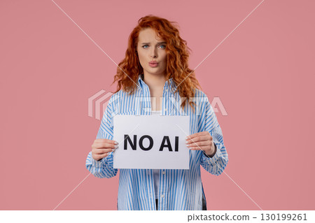 Pretty Woman Holds Sign No Ai With Serious Face, Pink Studio Visual Protest Pretty Woman Holds Sign No Ai With Serious Face, Pink Studio Visual Protest 130199261