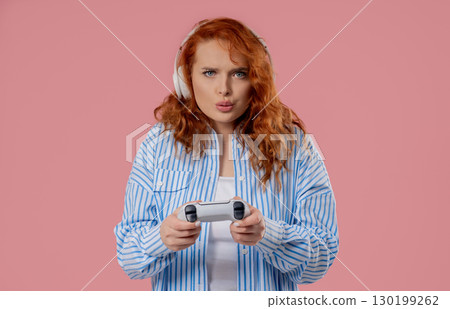 Young Pretty Gamer Woman Playing Online Video Game On Console With Joystick Young Pretty Gamer Woman Playing Online Video Game On Console With Joystick 130199262