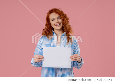 Woman Holding Horizontal White A4 Paper Poster. Copy Space. Mock-up Banner, Add Woman Holding Horizontal White A4 Paper Poster. Copy Space. Mock-up Banner, Add 130199265