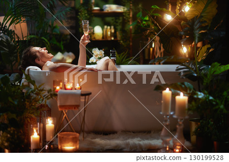 Joyful Spa: Woman Celebrating with Champagne Joyful Spa: Woman Celebrating with Champagne 130199528