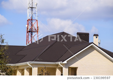 Decorative metal on the roof of the house. Decorative metal on the roof of the house. 130199597
