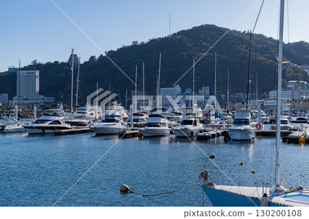 A view of Atami's boat yard lined with privately owned cruisers 130200108