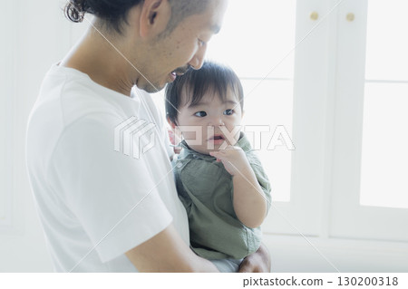 A father hugging a child A father hugging a child 130200318
