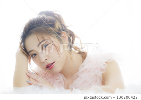 Woman in a pink tulle dress Woman in a pink tulle dress 130200422