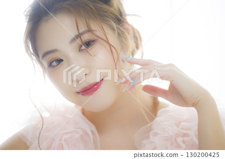 Woman in a pink tulle dress 130200425