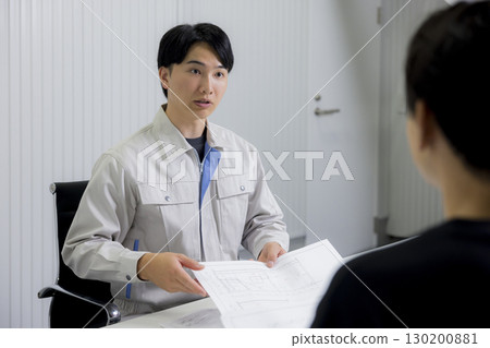 A man in work clothes having a meeting 130200881