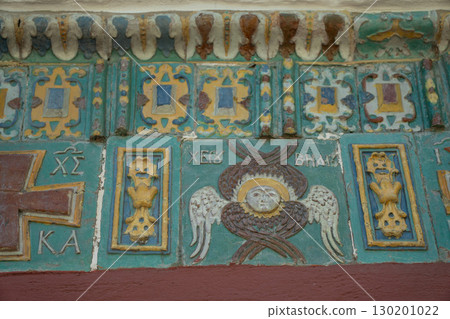 Ornate ceramic tilework featuring a winged seraphim face, floral motifs, and Orthodox Christian symbols in rich green, yellow, blue, and red tones 130201022