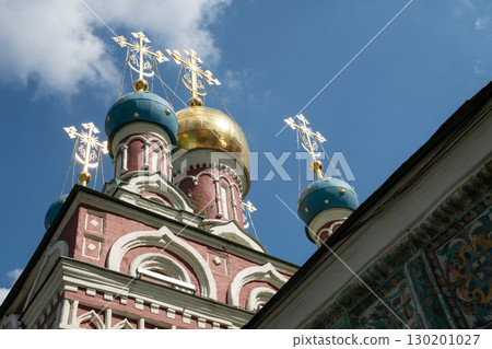 Ornate domes of the Assumption Church (Uspenskaya) in Taganka district, Moscow, with gleaming golden and blue cupolas crowned by Orthodox crosses 130201027
