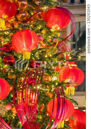A tree decorated with red lanterns, gold ornaments, and festive lights in Moscow A tree decorated with red lanterns, gold ornaments, and festive lights in Moscow 130201043