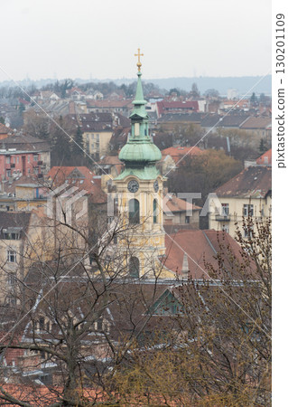 Close-up view of the Church of St. Anne with its distinctive green dome and baroque architecture Close-up view of the Church of St. Anne with its distinctive green dome and baroque architecture 130201109