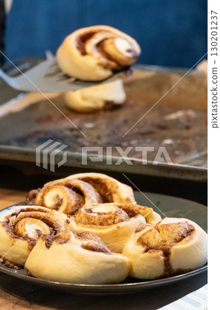 Close-up cinnabon buns freshly baked before applying cream Close-up cinnabon buns freshly baked before applying cream 130201237
