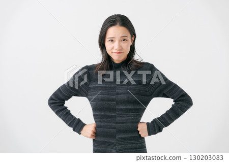 Portrait of a woman in her 30s with a troubled expression 130203083