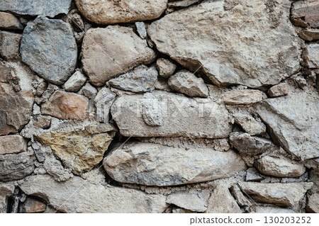 Texture of a massive Greek stone with various shades in Crete 130203252