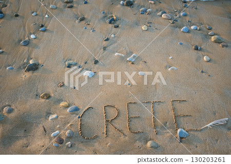 Word Crete written by hand on sand. The concept of tourism on this beautiful paradise island 130203261