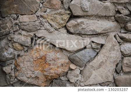 Texture of a massive Greek stone with various shades in Crete 130203287