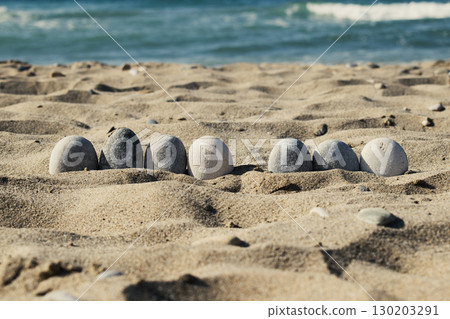 Word Good Day Written on Pebbles at the Beach 130203291