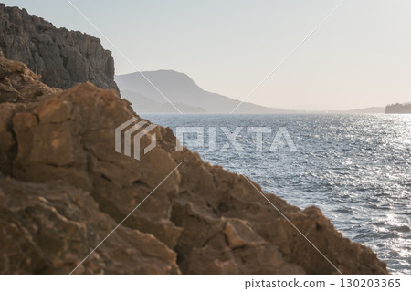 View of the blue sea from a cliff. Greek landscape in Crete View of the blue sea from a cliff. Greek landscape in Crete 130203365