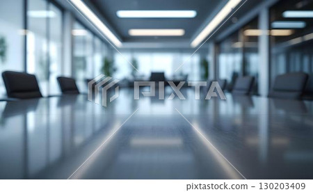 A modern office meeting room with a conference table and chairs, prepared for discussions and teamwork A modern office meeting room with a conference table and chairs, prepared for discussions and teamwork 130203409