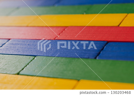 Bright multicolor wooden bricks, children's background in brick layout 130203468