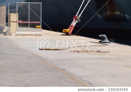 Mooring of a vessel in the port using mooring lines to a bollard on the quay 130203543