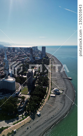 Batumi, Georgia: Aerial View of a Modern City with Port, Skyscrapers, and Breathtaking Nature 130203643