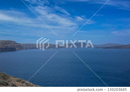 Endless blue sea and view of nearby islands near Santorini Endless blue sea and view of nearby islands near Santorini 130203685