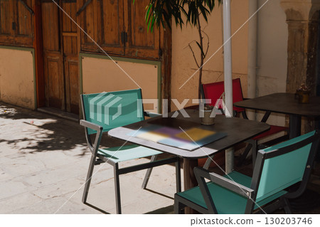 Outdoor dining area near the house on a narrow street of the old town of Rethymno 130203746