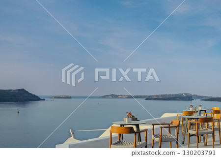 View of the sea from the terrace of a Greek restaurant on the island of Santorini View of the sea from the terrace of a Greek restaurant on the island of Santorini 130203791