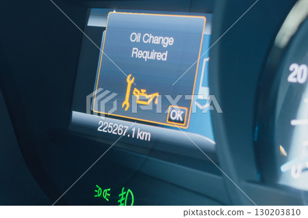 Oil change alert on a car dashboard display 130203810
