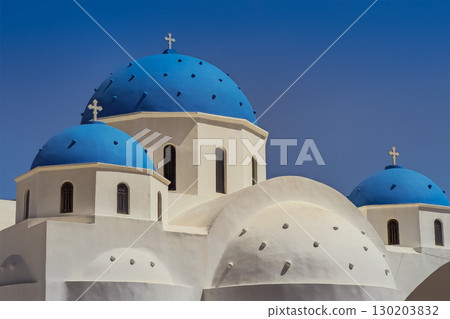 The most famous Catholic church in Santorini. Church of the Three Bells. White walls and blue domes 130203832