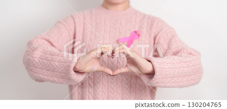 Pink October Breast Cancer Awareness month, woman with pink Ribbon for concepts of support people life and illness. National cancer survivors month, Women Health day and February World cancer day 130204765