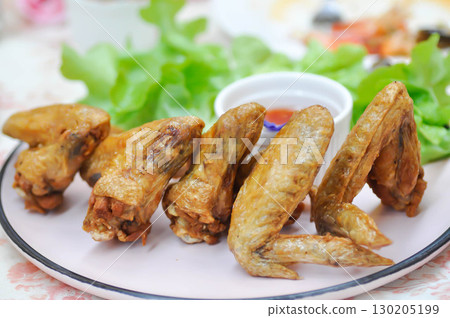chicken wings or deep fried chicken , fried chicken and sauce 130205199