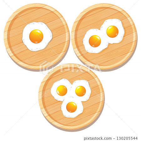 Fried Eggs on Wooden Cutting Boards Top View 130205544