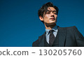 Businessman with blue sky background | Suit, career, office, business scene 130205760