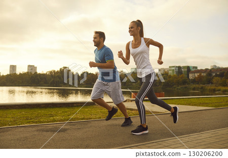 Positive Jogging Couple in the City Park 130206200