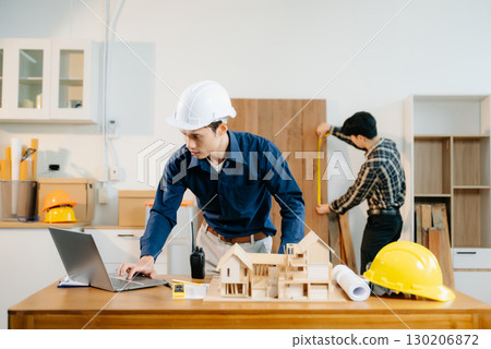 Engineer teams meeting working together wear worker helmets hardhat with on architectural project site Engineer teams meeting working together wear worker helmets hardhat with on architectural project site 130206872