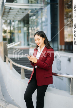 oung Asian business woman leader entrepreneur, professional manager holding digital tablet computer oung Asian business woman leader entrepreneur, professional manager holding digital tablet computer 130206986