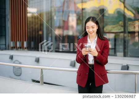 oung Asian business woman leader entrepreneur, professional manager holding digital tablet computer oung Asian business woman leader entrepreneur, professional manager holding digital tablet computer 130206987