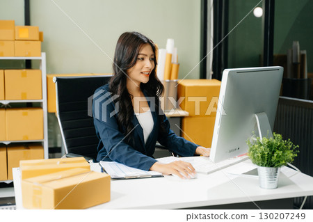 Startup small business SME, Entrepreneur owner woman using smartphone or tablet taking receive and checking Startup small business SME, Entrepreneur owner woman using smartphone or tablet taking receive and checking 130207249