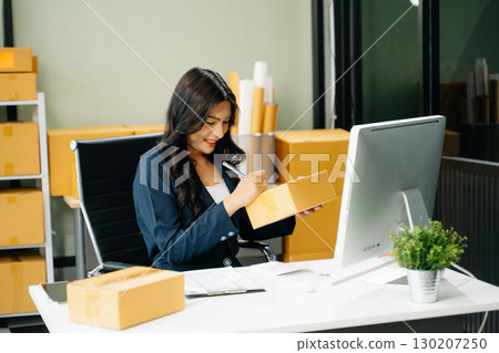 Startup small business SME, Entrepreneur owner woman using smartphone or tablet taking receive and checking 130207250