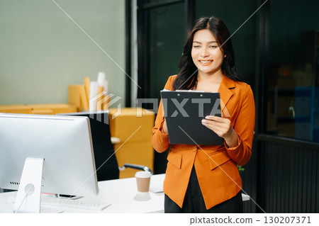 Startup small business SME, Entrepreneur owner woman using smartphone or tablet taking receive and checking 130207371