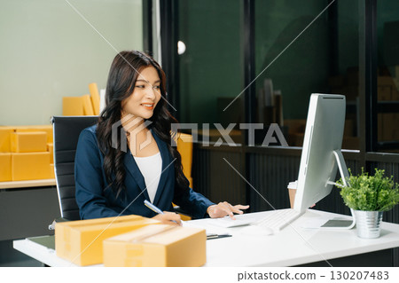 Startup small business SME, Entrepreneur owner woman using smartphone or tablet taking receive and checking Startup small business SME, Entrepreneur owner woman using smartphone or tablet taking receive and checking 130207483
